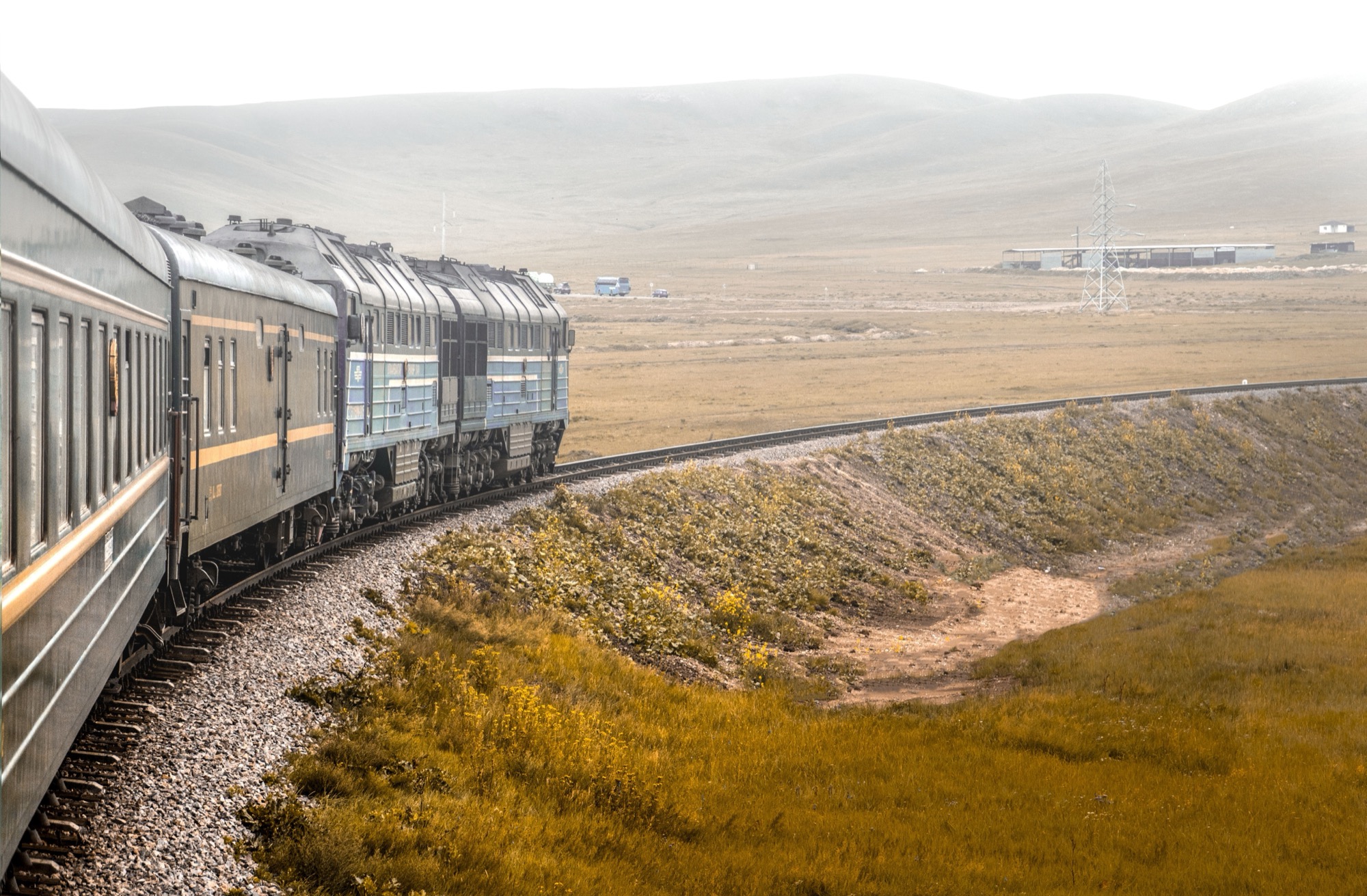 Passenger train on the Trans-Mongolian railway crossing Mongolia